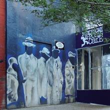 Example card. Outside view of the Nuyorican Poets Cafe in New York City, from which slams were broadcast live and worldwide on the radio. Photo: David Shankbone, 2008.